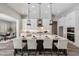 Modern kitchen island with seating, stainless steel appliances, and sleek design at 9903 E Rotation Dr, Mesa, AZ 85212