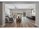 Open-concept living space with hardwood floors, modern furnishings and backyard views at 9903 E Rotation Dr, Mesa, AZ 85212