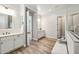 Spacious main bathroom featuring double vanities, tile floors, and a glass shower at 9903 E Rotation Dr, Mesa, AZ 85212