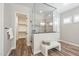 Main bathroom with modern glass shower and walk-in closet at 9903 E Rotation Dr, Mesa, AZ 85212