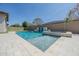 Beautiful pool with baja step, spa and custom water feature at 9903 E Rotation Dr, Mesa, AZ 85212