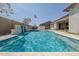 Backyard oasis with sparkling pool, water feature, and outdoor living space at 9903 E Rotation Dr, Mesa, AZ 85212