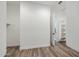 Open walk-in closet featuring custom shelving and wood floors at 9903 E Rotation Dr, Mesa, AZ 85212