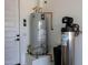 Water heater and filtration system inside the garage at 9903 E Rotation Dr, Mesa, AZ 85212