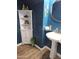 Stylish powder room with pedestal sink, corner cabinet and decor accents at 1255 N Arizona Ave # 1112, Chandler, AZ 85225
