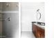 Modern bathroom featuring custom tile shower and granite vanity at 3907 E Marilyn Rd, Phoenix, AZ 85032