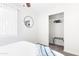 This bedroom is bright and airy and features carpeted floors and closet space at 3907 E Marilyn Rd, Phoenix, AZ 85032