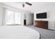 Well-lit bedroom featuring carpeted floors, a large window and a closet at 3907 E Marilyn Rd, Phoenix, AZ 85032