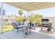 An outdoor patio featuring a grill, and comfortable seating. Perfect for entertaining at 3907 E Marilyn Rd, Phoenix, AZ 85032