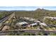 Extensive commercial area with shopping centers, ample parking, and surrounding desert landscape at 8625 E Camino Vivaz --, Scottsdale, AZ 85255