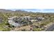 Aerial view of a commercial area with shopping centers, restaurants, and residential buildings at 8625 E Camino Vivaz --, Scottsdale, AZ 85255
