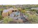 Expansive aerial view showcases the desert home, pool, and meticulously landscaped grounds at 8625 E Camino Vivaz --, Scottsdale, AZ 85255
