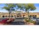 Shopping center entrance with landscaped walkway leading to various stores and offices at 8625 E Camino Vivaz --, Scottsdale, AZ 85255