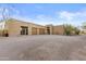 Exterior shot showcasing the desert home and circular driveway with desert landscaping at 8625 E Camino Vivaz --, Scottsdale, AZ 85255