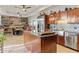 Open kitchen design with stainless steel appliances and an island open to the dining area at 8625 E Camino Vivaz --, Scottsdale, AZ 85255