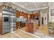 Gourmet kitchen with stainless steel appliances, custom cabinetry, and an island at 8625 E Camino Vivaz --, Scottsdale, AZ 85255
