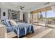 The main bedroom offers backyard views, a plush king bed, and stylish decor, creating a peaceful environment at 8625 E Camino Vivaz --, Scottsdale, AZ 85255