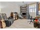 Comfortable office with built-in bookshelves, a relaxing leather chair, and a dedicated workspace at 8625 E Camino Vivaz --, Scottsdale, AZ 85255