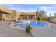 Backyard oasis features a swimming pool, tanning deck, built-in spa, and desert landscaping at 8625 E Camino Vivaz --, Scottsdale, AZ 85255