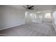 Large open loft space with neutral walls and carpet, offering flexibility for various uses at 1096 E Rolls E Rd, San Tan Valley, AZ 85143