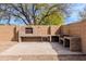 Backyard features a custom outdoor grill built from red brick in desert landscape at 1096 E Rolls E Rd, San Tan Valley, AZ 85143