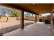 Covered outdoor patio overlooking a backyard with gravel and a desert landscape at 1096 E Rolls E Rd, San Tan Valley, AZ 85143
