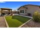 Backyard with a gazebo, artificial grass, and low-maintenance landscaping at 11148 E Tumbleweed Ave, Mesa, AZ 85212