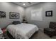 Cozy bedroom with neutral walls, plantation shutters, and comfortable furnishings creating a tranquil retreat at 11148 E Tumbleweed Ave, Mesa, AZ 85212