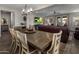 Inviting living and dining area with ample seating, a ceiling fan, and access to the outdoors at 11148 E Tumbleweed Ave, Mesa, AZ 85212