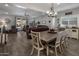 Bright and open living and dining area featuring tile floors and sliding glass doors to the backyard patio at 11148 E Tumbleweed Ave, Mesa, AZ 85212
