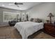 Serene main bedroom features plantation shutters, soft carpet, and ample natural light for ultimate comfort at 11148 E Tumbleweed Ave, Mesa, AZ 85212