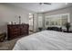 Spacious main bedroom with large windows, plantation shutters, and a cozy sitting area, perfect for relaxation at 11148 E Tumbleweed Ave, Mesa, AZ 85212