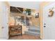 Spacious foyer with tiled floors, staircase with modern railings, and a decorative entry table at 1313 W Glenmere Dr, Chandler, AZ 85224