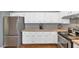 Bright kitchen featuring white cabinets, stainless steel appliances, and ample counter space at 1313 W Glenmere Dr, Chandler, AZ 85224