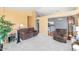 Cozy upstairs living room with neutral carpet, plush seating, and views to the kitchen at 1313 W Glenmere Dr, Chandler, AZ 85224