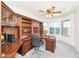 Home office featuring wood cabinetry, desk, and an exterior view from the window at 1313 W Glenmere Dr, Chandler, AZ 85224