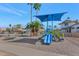 Community playground with a slide and a swing set, perfect for to enjoy at 1313 W Glenmere Dr, Chandler, AZ 85224