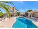 Inviting backyard pool with desert landscaping and a covered patio, perfect for outdoor entertaining at 1313 W Glenmere Dr, Chandler, AZ 85224