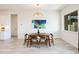 Cozy dining area with a modern table and chairs, complemented by natural light and stylish decor at 14429 N 75Th Dr, Peoria, AZ 85381