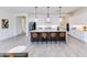 Open concept kitchen featuring a large island with seating, stainless appliances, and lots of storage at 14429 N 75Th Dr, Peoria, AZ 85381