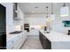Stylish kitchen with stainless steel appliances, white cabinetry, and a large center island with bar seating at 14429 N 75Th Dr, Peoria, AZ 85381