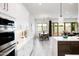 Bright kitchen with modern appliances opens to the dining and living area at 14429 N 75Th Dr, Peoria, AZ 85381