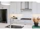 Bright kitchen with stainless appliances, sleek white cabinetry and spacious counter tops at 14429 N 75Th Dr, Peoria, AZ 85381