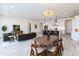Open concept home featuring kitchen island, dining area, and living room with stylish decor at 14429 N 75Th Dr, Peoria, AZ 85381