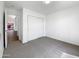 Neutral bedroom with carpet and a closet with sliding doors, offering comfort and storage at 1488 W Page Ave, Gilbert, AZ 85233