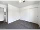 Neutral bedroom with carpet, closet, and views into the hallway; a comfortable and inviting space at 1488 W Page Ave, Gilbert, AZ 85233