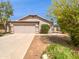 Charming single-story home with a well-manicured front yard and attached two-car garage at 1488 W Page Ave, Gilbert, AZ 85233