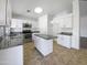 Bright kitchen with granite countertops, stainless steel appliances, and white cabinetry at 1488 W Page Ave, Gilbert, AZ 85233