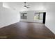 Bright living room featuring wood-look floors, black-framed windows, and a modern aesthetic at 1488 W Page Ave, Gilbert, AZ 85233