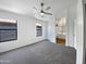 Minimalist main bedroom features plush carpet and ensuite bathroom at 1488 W Page Ave, Gilbert, AZ 85233